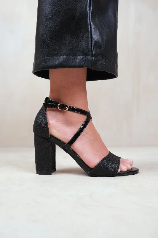 RUTH WIDE FIT HIGH BLOCK HEEL SANDALS WITH CROSS OVER ANKLE STRAP IN BLACK GLITTER