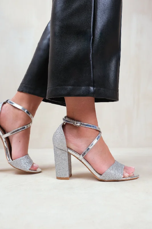 RUTH WIDE FIT HIGH BLOCK HEEL SANDALS WITH CROSS OVER ANKLE STRAP IN SILVER GLITTER